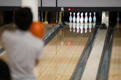MU Games Area Person setting up to bowl